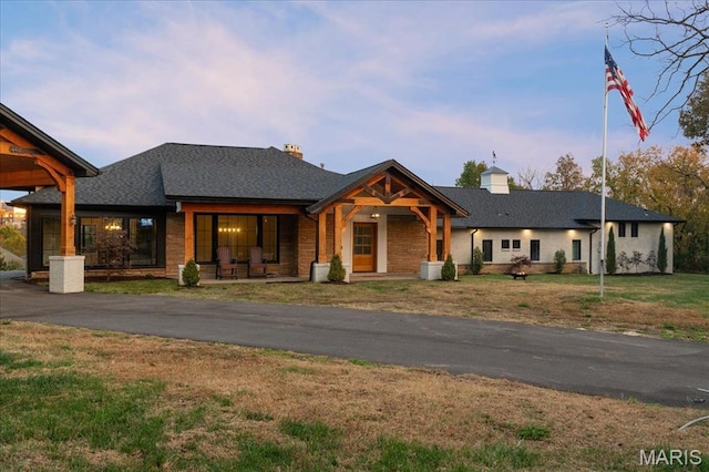 1824 Topping Rd, Saint Louis, MO 63131 - modern farmhouse featuring a chimney, a front lawn, and covered porch