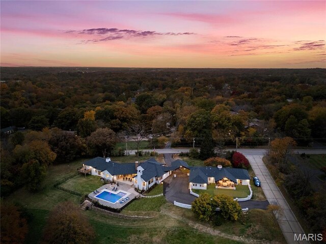 1824 Topping Rd, Saint Louis, MO 63131 - aerial view of property and surrounding area with a heavily wooded area and a pool area