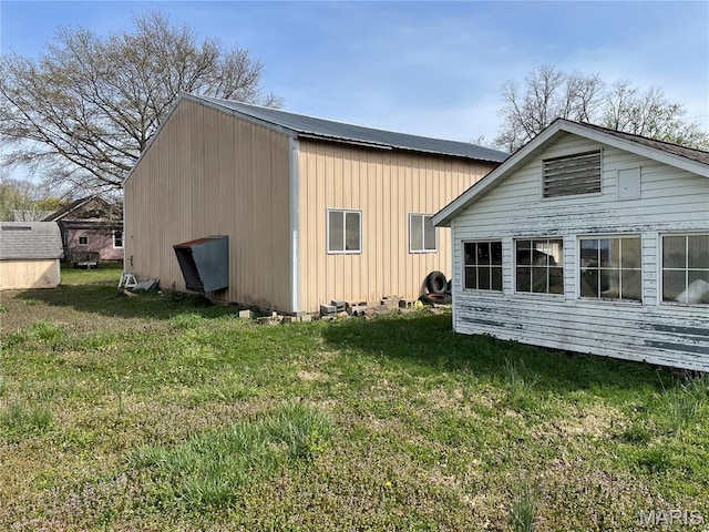 101 Cass St, Waterloo, IL 62298 - back of property featuring a yard and an outdoor structure