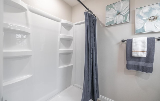 full bathroom featuring a shower stall
