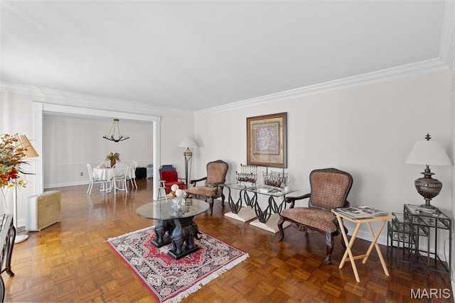 sitting room featuring ornamental molding and baseboards
