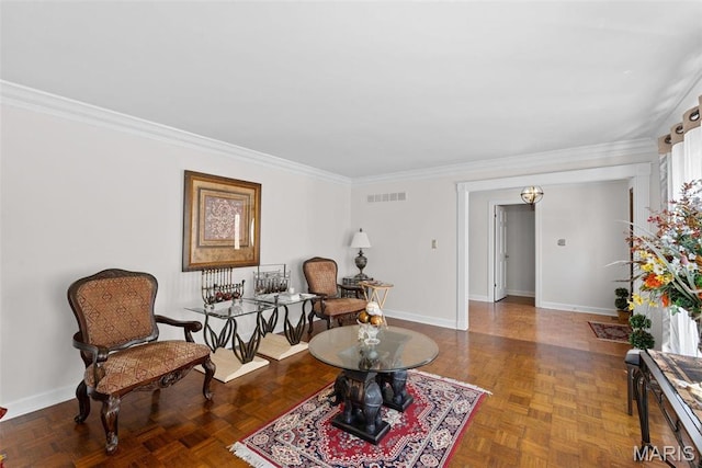 living area with ornamental molding and baseboards