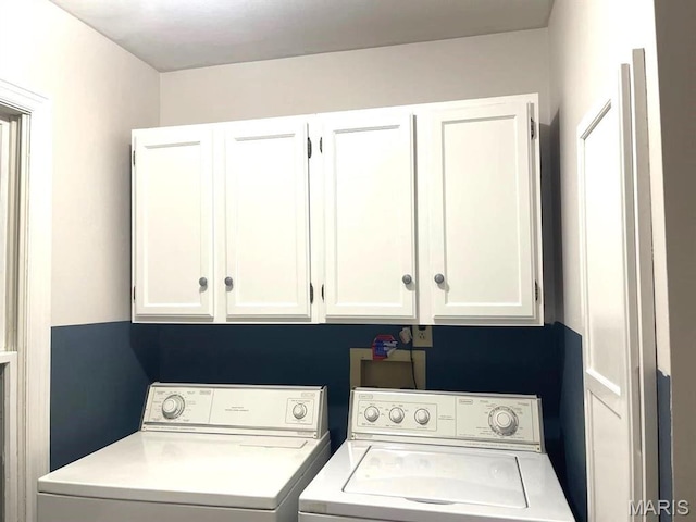 laundry area with cabinet space and washing machine and dryer