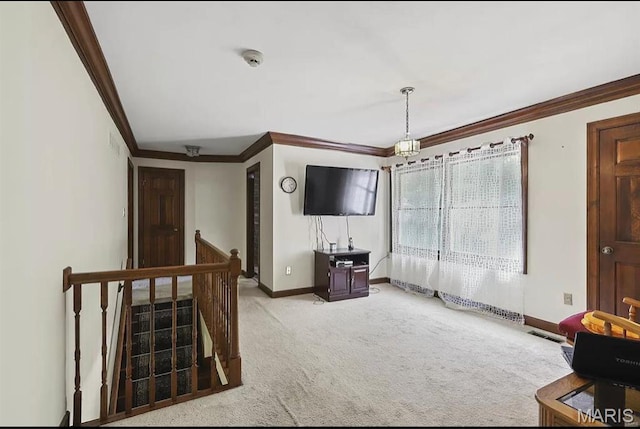 living room featuring crown molding, light carpet, and baseboards