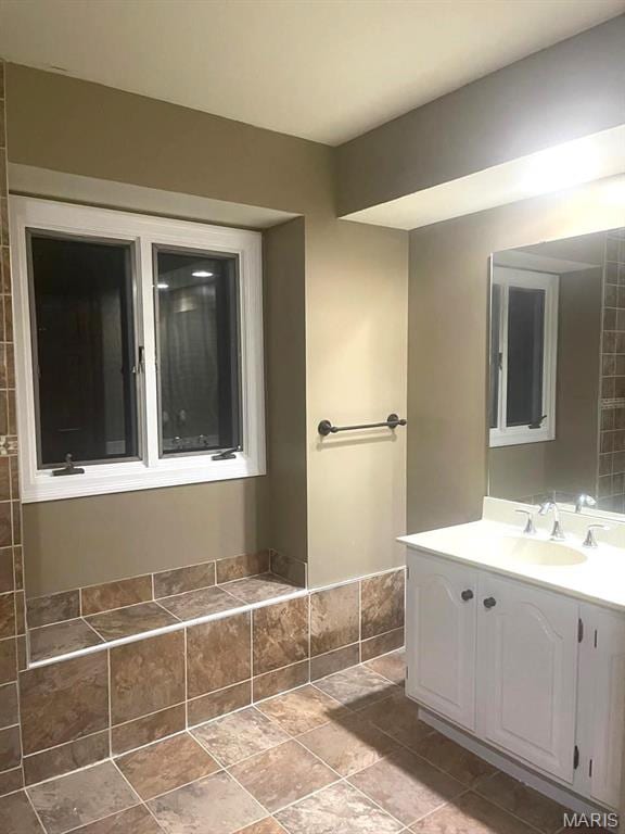 bathroom with vanity and stone finish flooring
