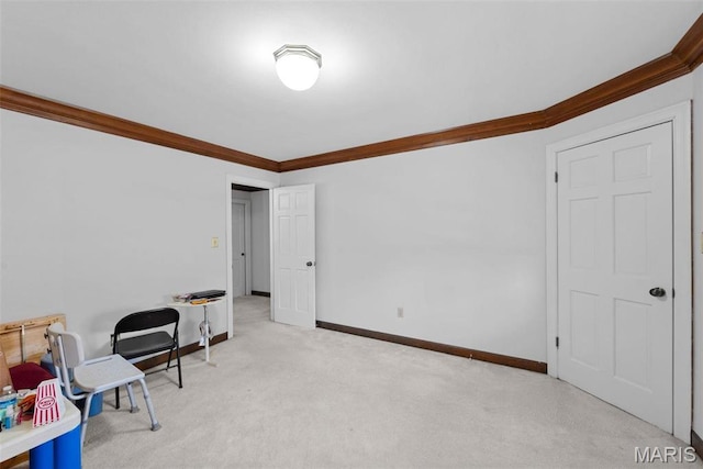 recreation room with crown molding, baseboards, and carpet flooring
