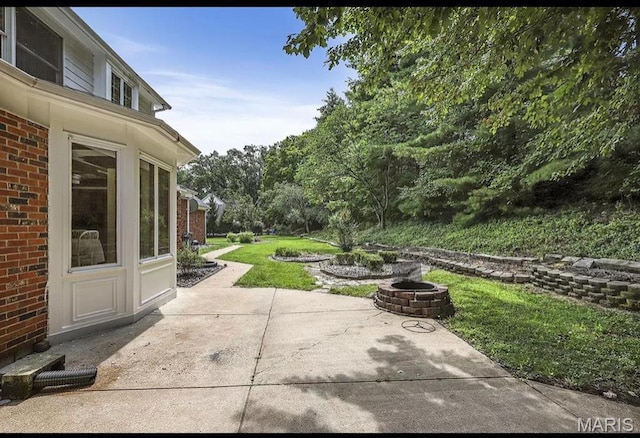 view of patio featuring an outdoor fire pit