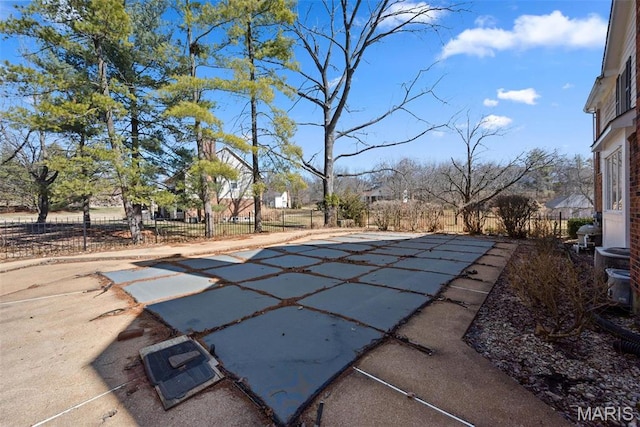 view of pool with fence and a patio