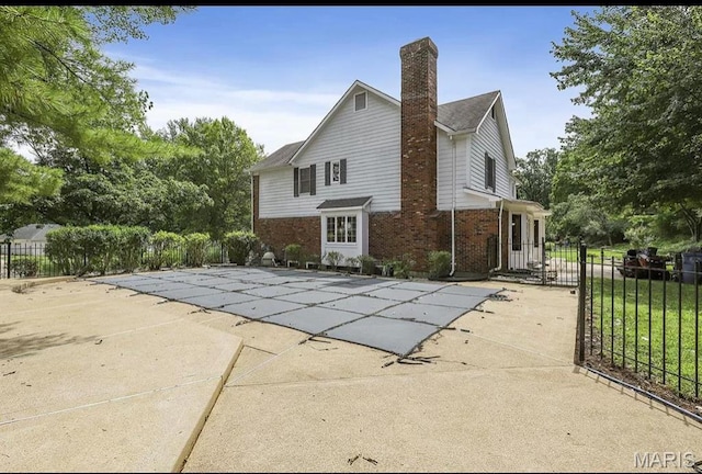 view of pool with fence and a patio area
