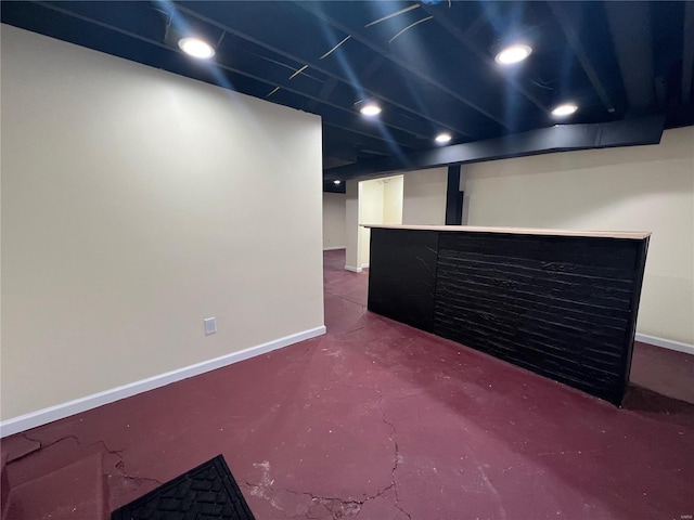 7100 Lexington Ave, Saint Louis, MO 63121 - finished below grade area featuring a bar, baseboards, and recessed lighting