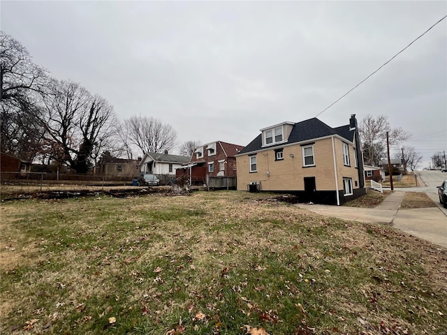 7100 Lexington Ave, Saint Louis, MO 63121 - view of property exterior with a chimney, central AC, and a residential view