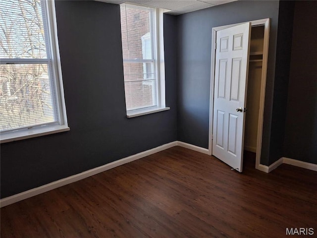 2709 Keokuk St, Saint Louis, MO 63118 - empty room featuring dark wood finished floors and baseboards
