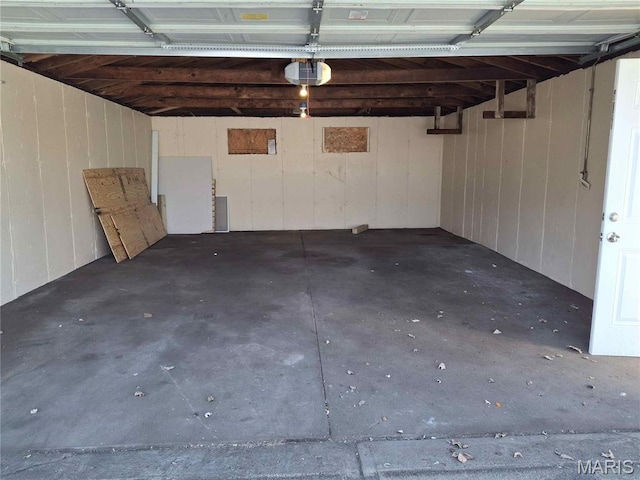 2709 Keokuk St, Saint Louis, MO 63118 - garage with a garage door opener and wooden walls