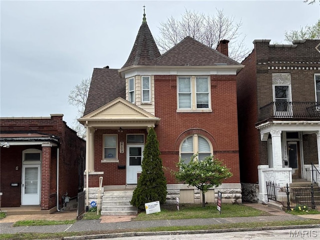 2709 Keokuk St, Saint Louis, MO 63118 - view of front of property featuring brick siding, a chimney, and a shingled roof
