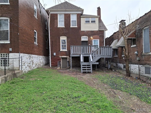 2709 Keokuk St, Saint Louis, MO 63118 - back of house with brick siding, a chimney, and a deck