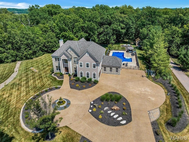 244 US Dr, Wentzville, MO 63385 - view of subject property featuring a pool and a forest