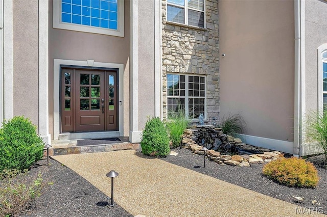 244 US Dr, Wentzville, MO 63385 - property entrance featuring stone siding and stucco siding