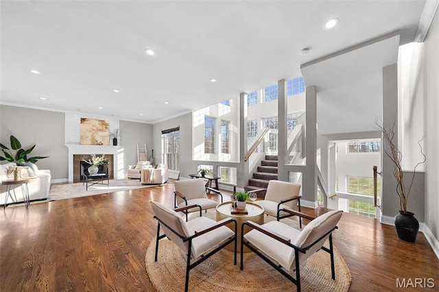 244 US Dr, Wentzville, MO 63385 - living room with healthy amount of natural light, a fireplace, baseboards, recessed lighting, and ornamental molding