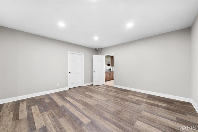 244 US Dr, Wentzville, MO 63385 - empty room with baseboards, wood finished floors, and recessed lighting