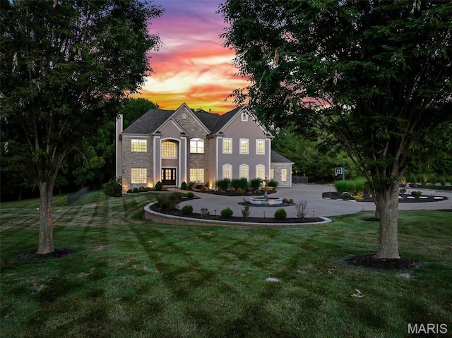 244 US Dr, Wentzville, MO 63385 - view of front facade featuring a front yard and curved driveway