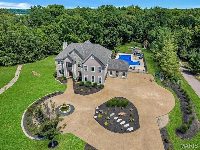 244 US Dr, Wentzville, MO 63385 - aerial view of property and surrounding area featuring a pool area and a forest