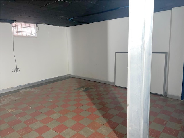 6817 Gravois Ave, Saint Louis, MO 63116 - below grade area featuring light flooring and baseboards