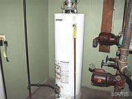 6817 Gravois Ave, Saint Louis, MO 63116 - utility room with gas water heater