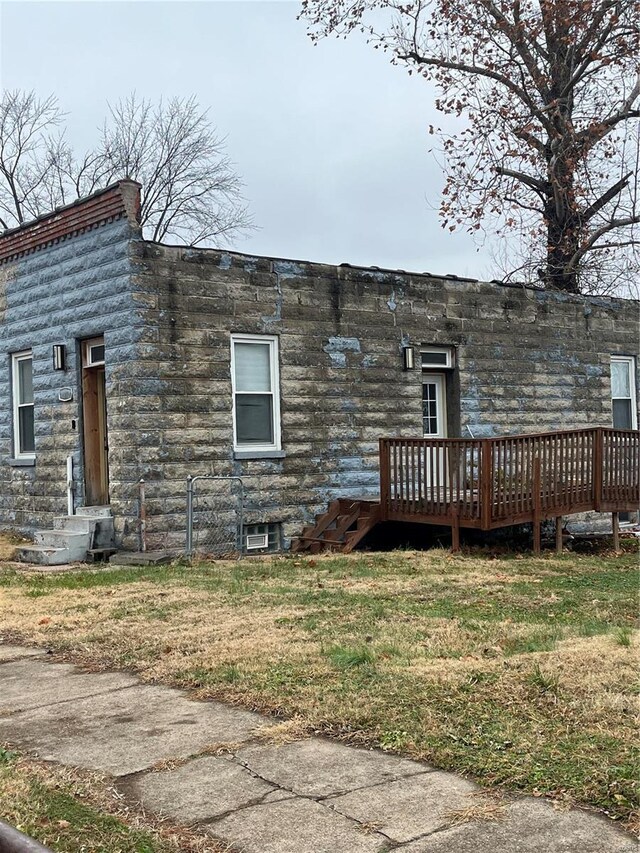 5316 Zealand St, Saint Louis, MO 63107 - rear view of house with a deck and a lawn