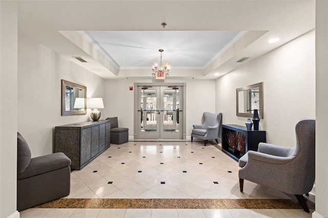 lobby with crown molding and recessed lighting