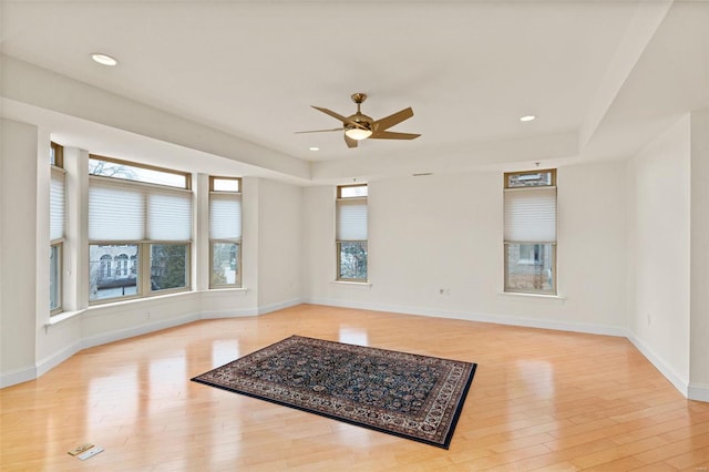 unfurnished room featuring light wood finished floors, ceiling fan, baseboards, and recessed lighting