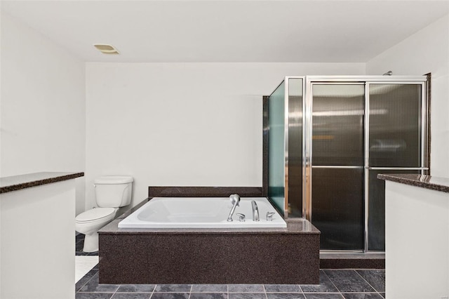 full bath featuring a shower stall, toilet, and a garden tub