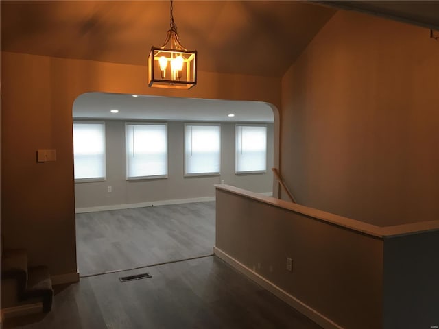2812 Annapolis Ave, Saint Louis, MO 63114 - corridor featuring arched walkways, wood finished floors, and plenty of natural light