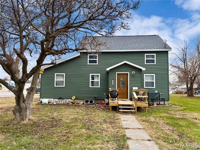 301 W Summer St, Monroe City, MO 63456 - view of front of home with a front yard, a wooden deck, and roof with shingles