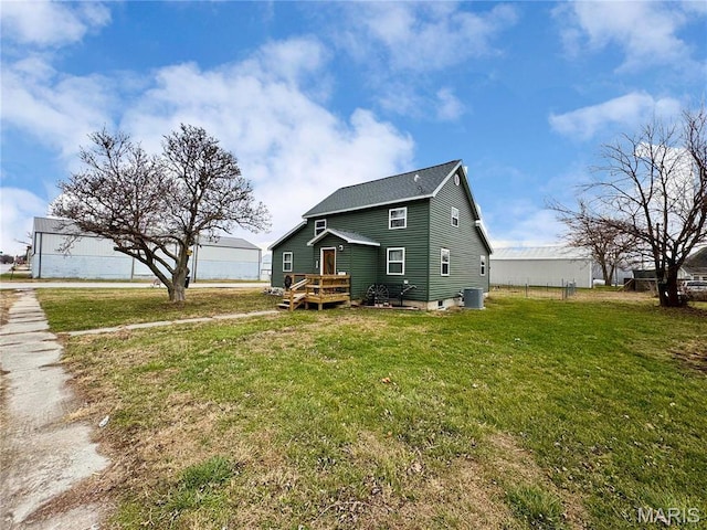 301 W Summer St, Monroe City, MO 63456 - view of side of property featuring cooling unit, a lawn, and roof with shingles