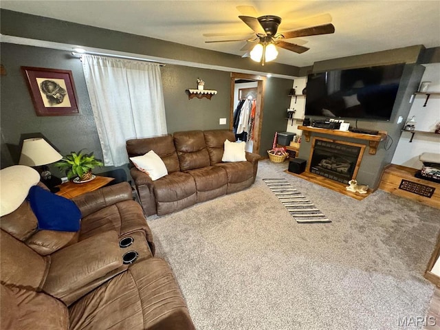 301 W Summer St, Monroe City, MO 63456 - carpeted living room with a ceiling fan and a fireplace