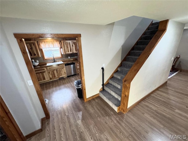301 W Summer St, Monroe City, MO 63456 - stairway with wood finished floors and baseboards