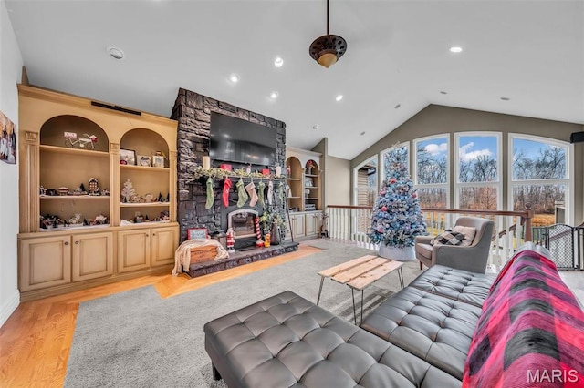 2942 Eagle Pointe Dr, Wentzville, MO 63385 - living area with lofted ceiling, recessed lighting, and wood finished floors