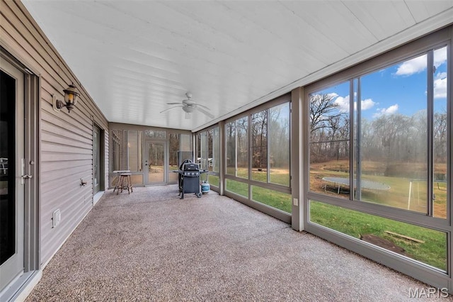 2942 Eagle Pointe Dr, Wentzville, MO 63385 - unfurnished sunroom with a ceiling fan and a water view