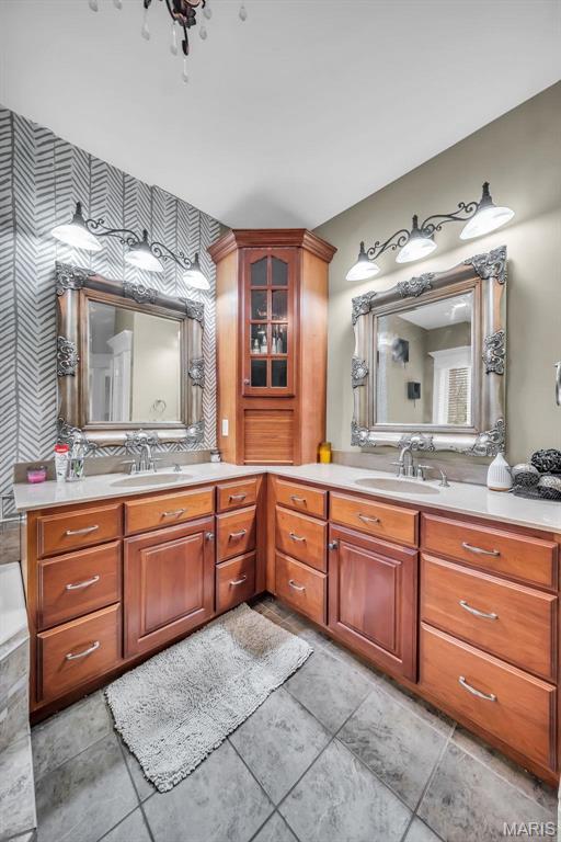 2942 Eagle Pointe Dr, Wentzville, MO 63385 - full bath featuring wallpapered walls and double vanity