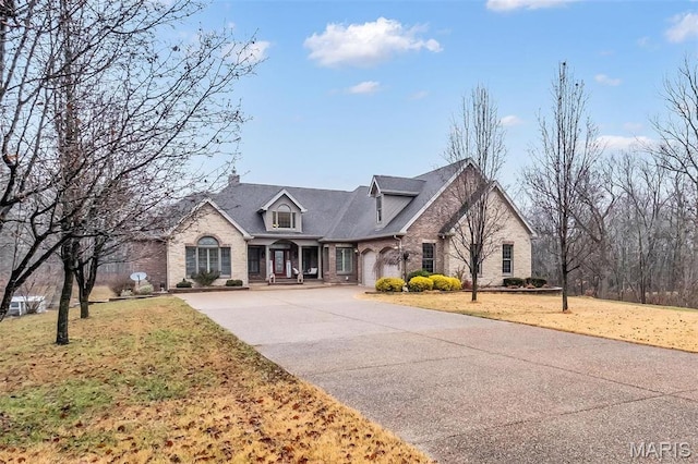 2942 Eagle Pointe Dr, Wentzville, MO 63385 - traditional-style house featuring brick siding, concrete driveway, and a front yard