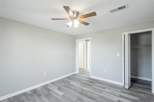 121 W Hicks St, Cardwell, MO 63829 - unfurnished bedroom featuring wood finished floors, baseboards, a closet, and a ceiling fan