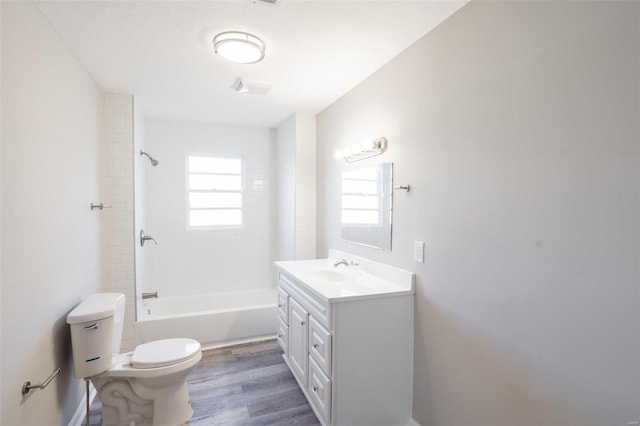121 W Hicks St, Cardwell, MO 63829 - full bathroom with toilet, washtub / shower combination, vanity, and wood finished floors