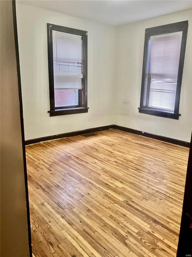 4319 S 38th St, Saint Louis, MO 63116 - empty room featuring wood-type flooring and baseboards
