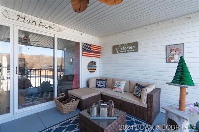 sunroom / solarium featuring outdoor lounge area