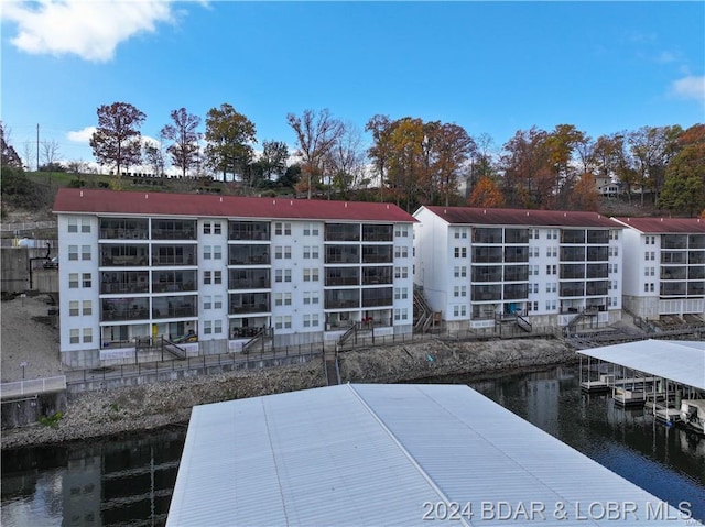 view of apartment building / complex featuring a water view