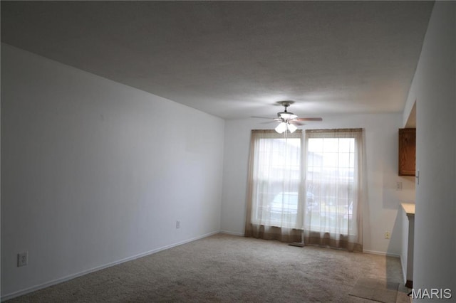 3181 Carefree Ln Unit A, Florissant, MO 63033 - unfurnished room featuring carpet flooring, ceiling fan, and baseboards