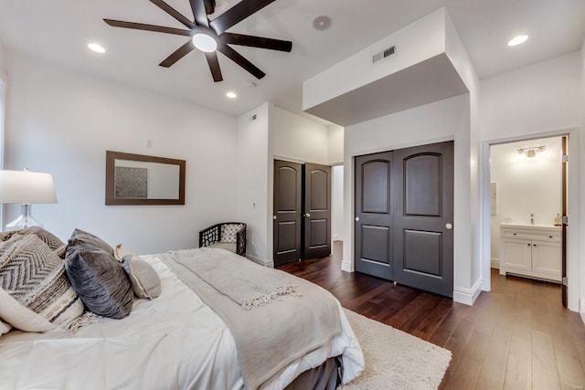 1029 Lami, Saint Louis, MO 63104 - bedroom with dark wood-style flooring, baseboards, connected bathroom, ceiling fan, and recessed lighting