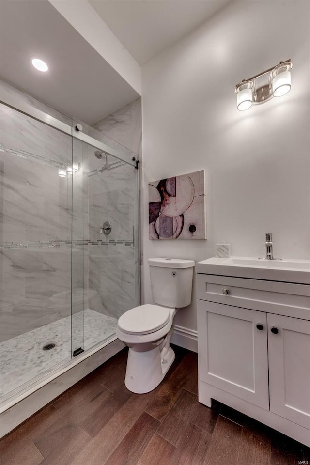 1029 Lami, Saint Louis, MO 63104 - bathroom featuring toilet, a shower stall, vanity, wood finished floors, and recessed lighting