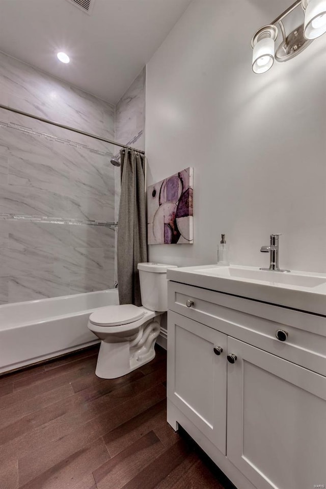 1029 Lami, Saint Louis, MO 63104 - bathroom featuring toilet, vanity, wood finished floors, shower / bath combo with shower curtain, and recessed lighting