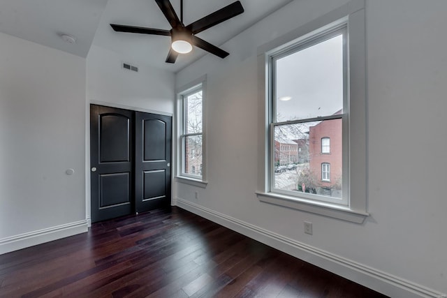 1029 Lami, Saint Louis, MO 63104 - unfurnished bedroom with dark wood-style floors, baseboards, a closet, and a ceiling fan